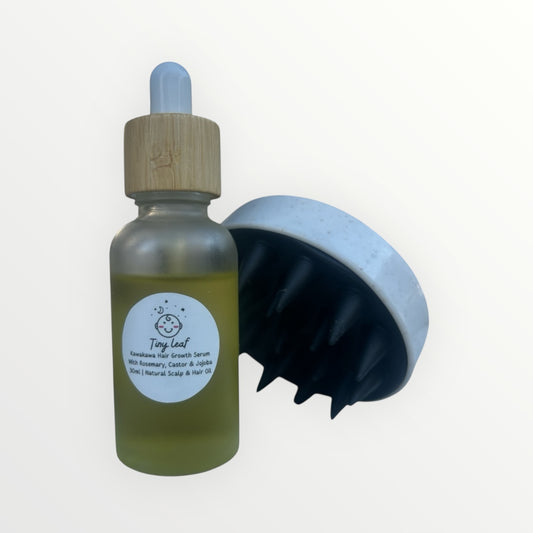 Bottle of Tonic Leaf hair care product with a brush on a white background