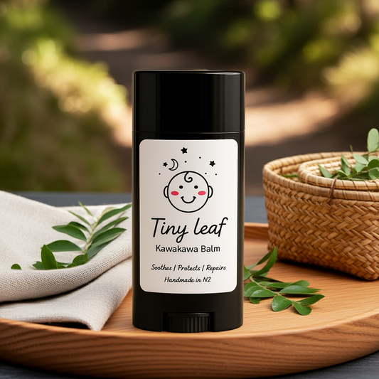 Hand holding Tiny Leaf repair stick made with Kawakawa and Manuka