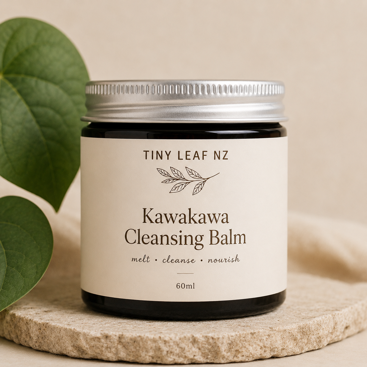 Kawakawa Cleansing Balm jar with 'Tiny Leaf NZ' branding on a neutral background