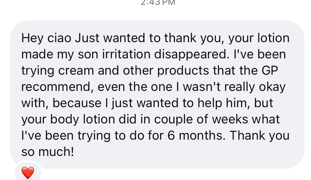 A text message screenshot with a light gray background and black text thanking a seller for a body lotion that helped a child stop irritation. A small red heart icon appears at the bottom left.