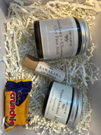 Kawakawa skincare products and a Crunchie chocolate bar on shredded paper