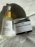 Hydrating Serum and Kawakawa Whipped Balm on a textured surface
