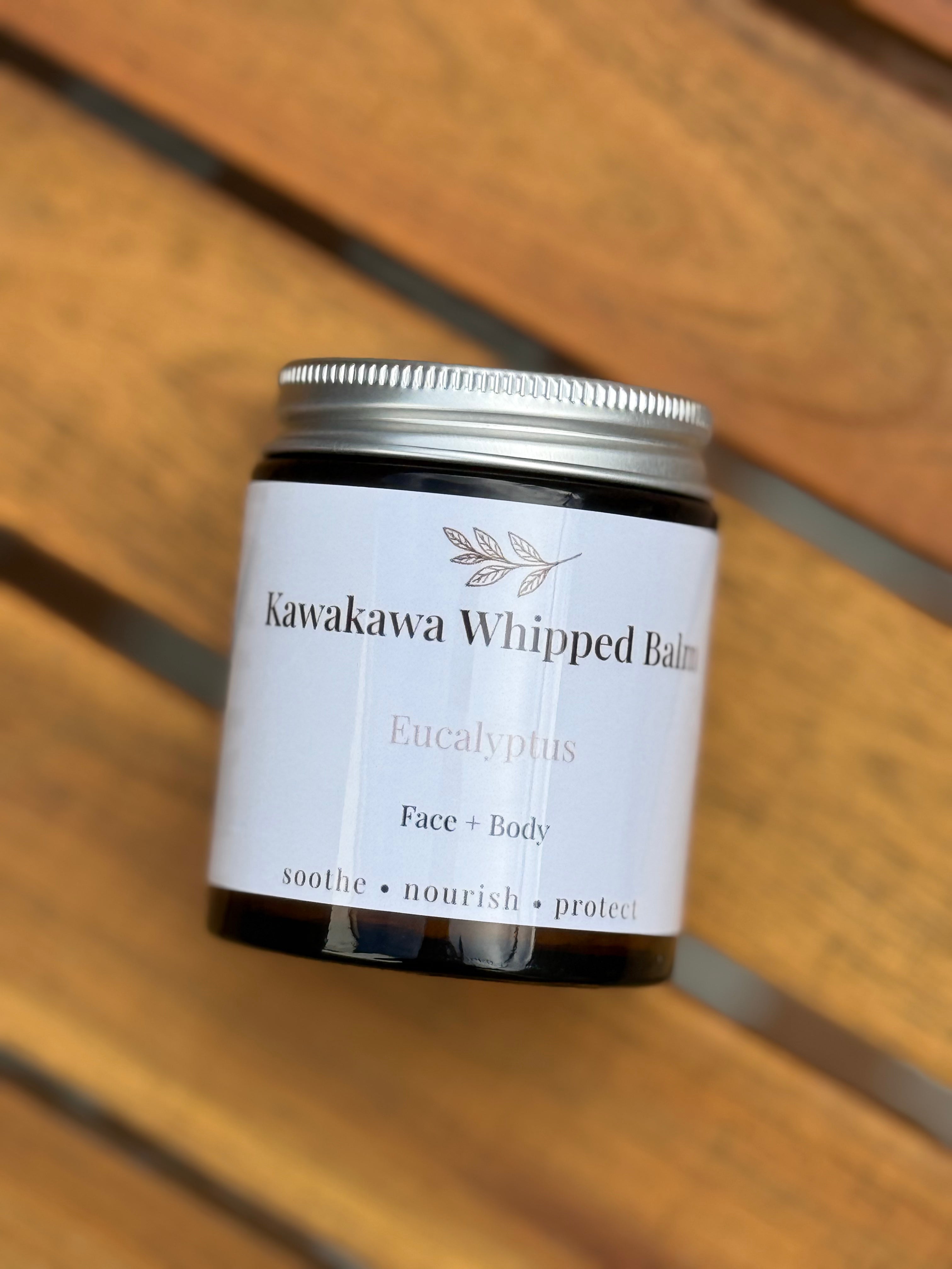 Jar of Kawakawa Whipped Balm on a wooden surface