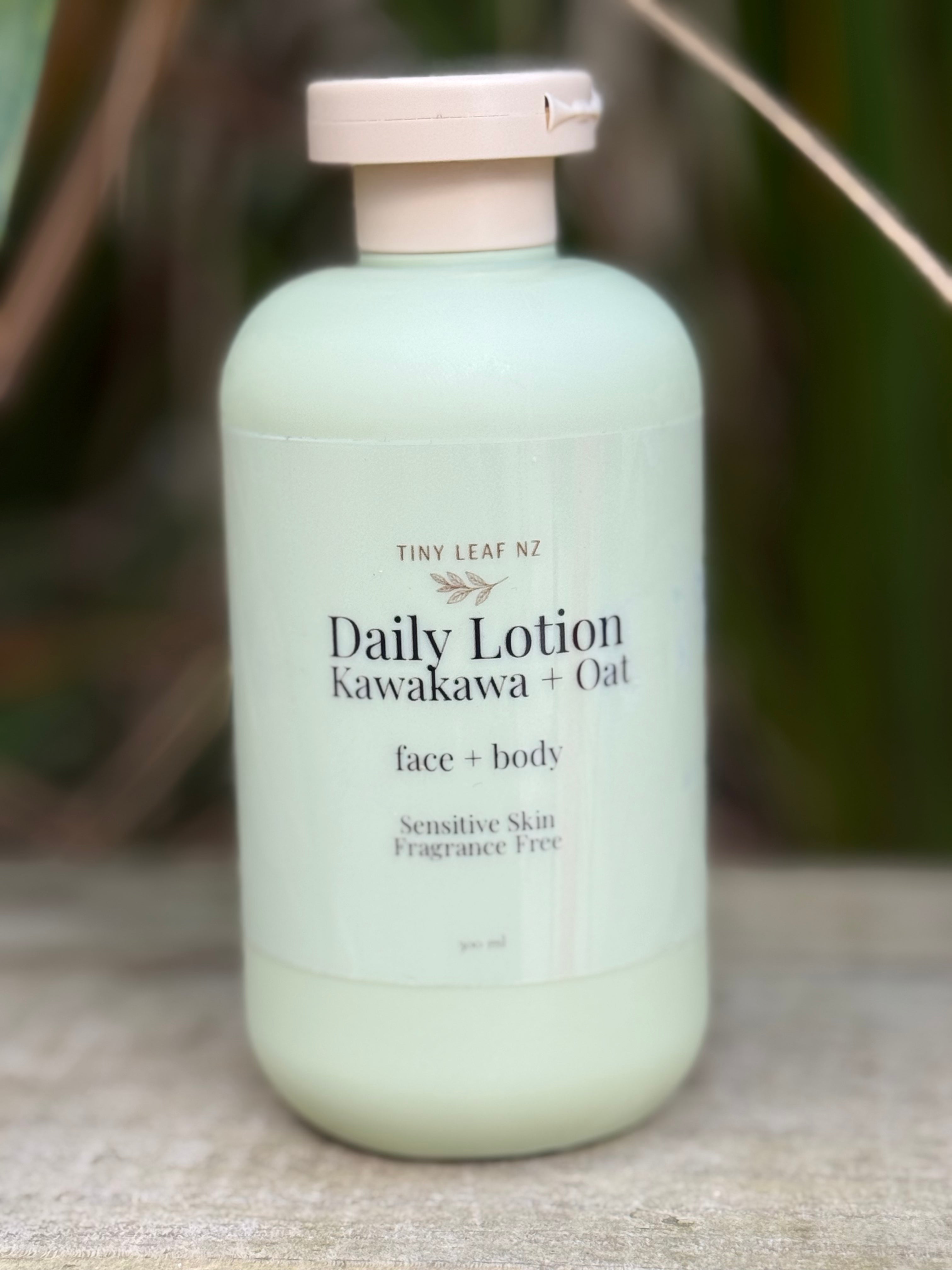 Green bottle of Daily Lotion with wooden cap on a textured surface