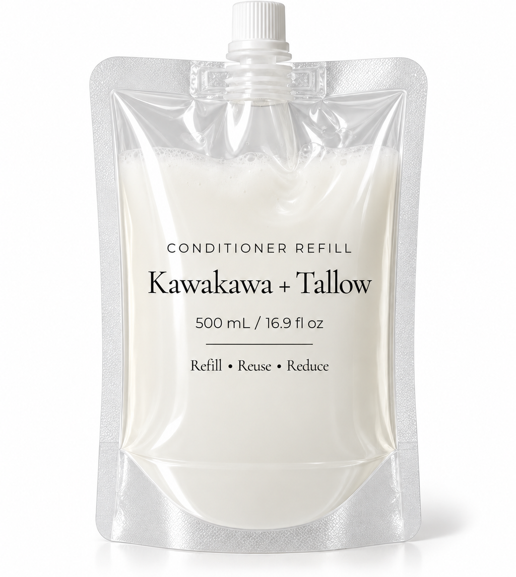 A 500 mL refill pouch of Kawakawa + Tallow conditioner, filled with an off-white cream-colored liquid. The product is packaged in a clear, resealable stand-up pouch with a white screw cap, set against a clean white background.