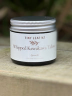 Jar of Tiny Leaf NZ Whipped Kawakawa Tallow on a wooden surface