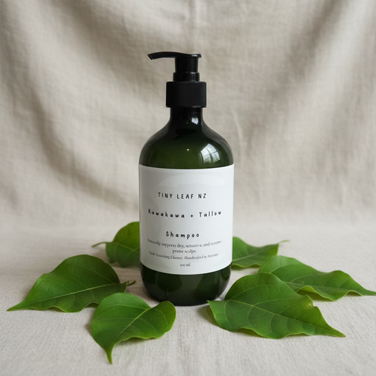 Dark green Bottle of tiny leaf nz Kawakawa tallow shampoo with koru design on label