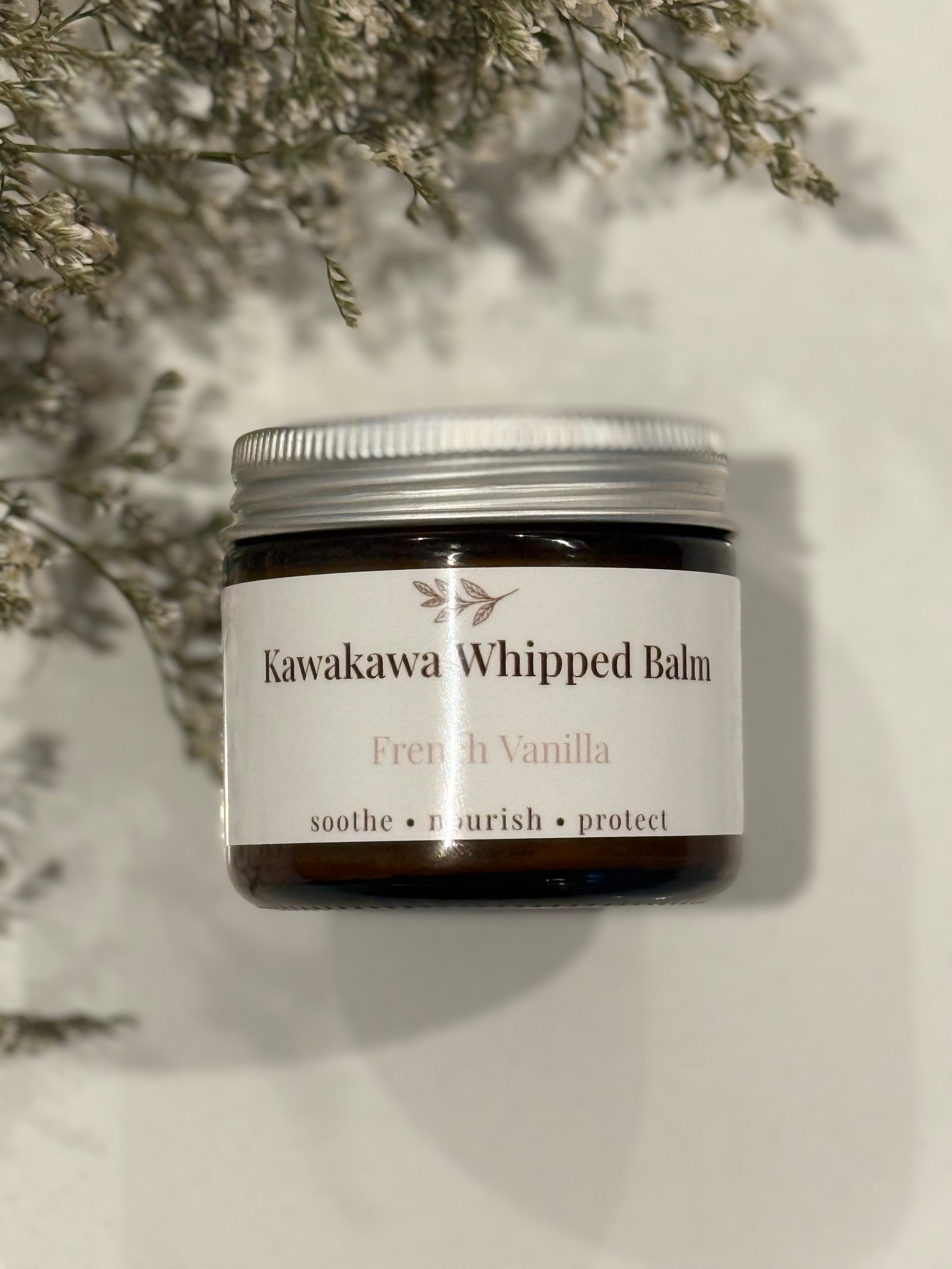 Jar of Kawakawa Whipped Balm with a white label on a light background