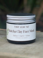 Jar of Tiny Leaf NZ Matcha Clay Face Mask on a blurred natural background