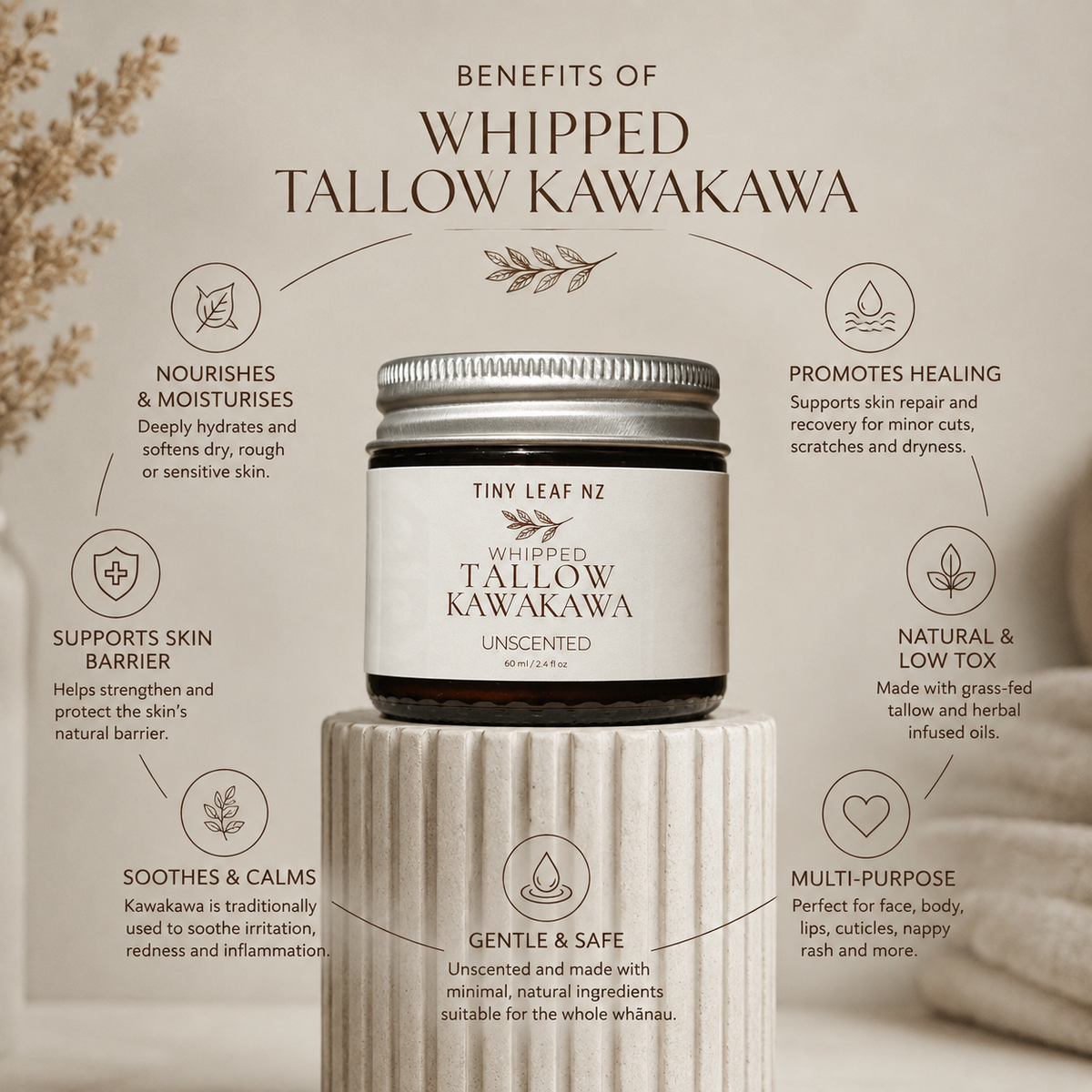 A jar of Tiny Leaf Nz Whipped Tallow Kawakawa Unscented skincare cream centered on a beige background with decorative text detailing its benefits.