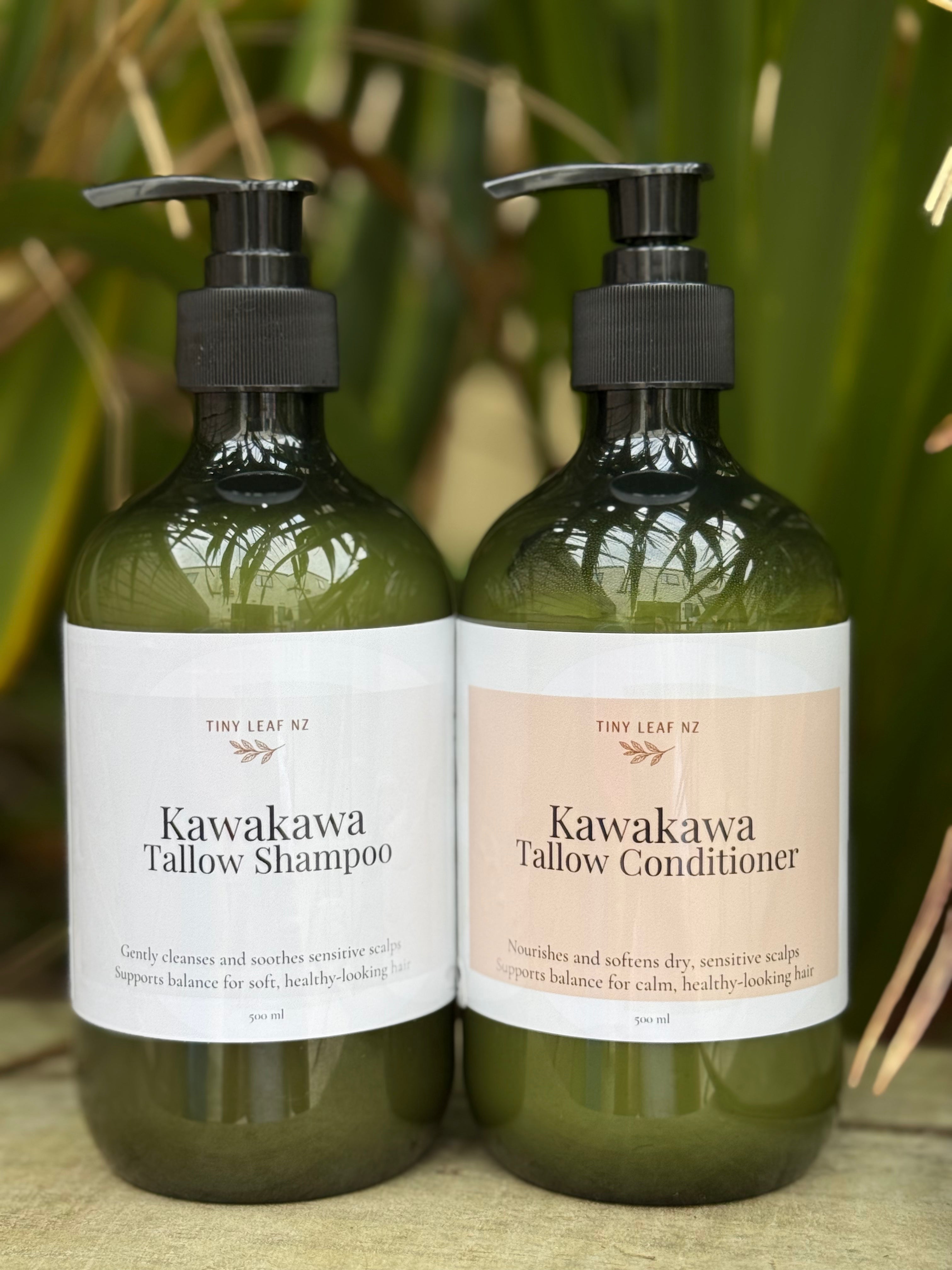 Two bottles of Kawakawa Tallow Shampoo and Conditioner with pump dispensers on a natural background.
