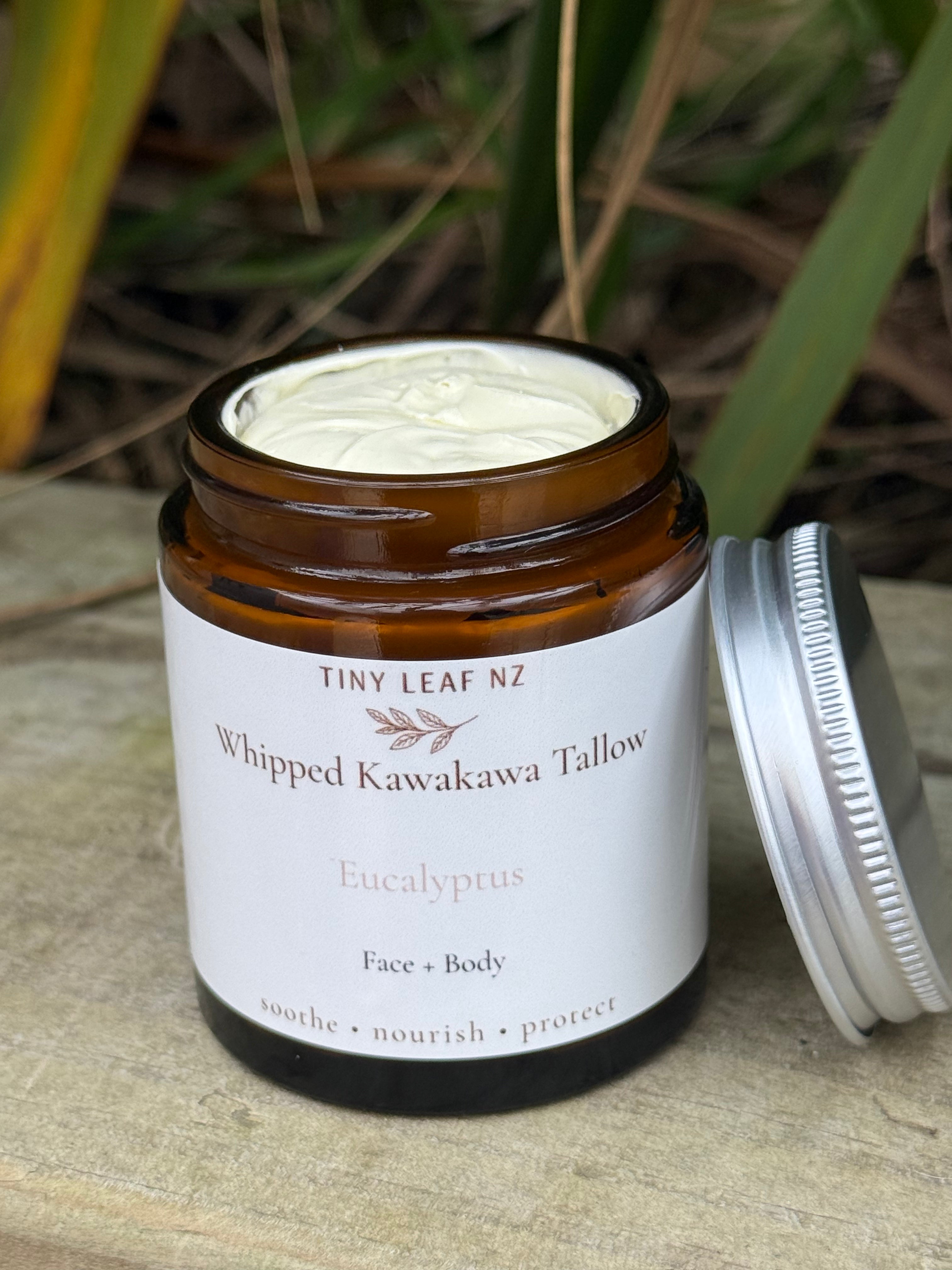 Jar of Tiny Leaf NZ whipped product with a white lid on a wooden surface.