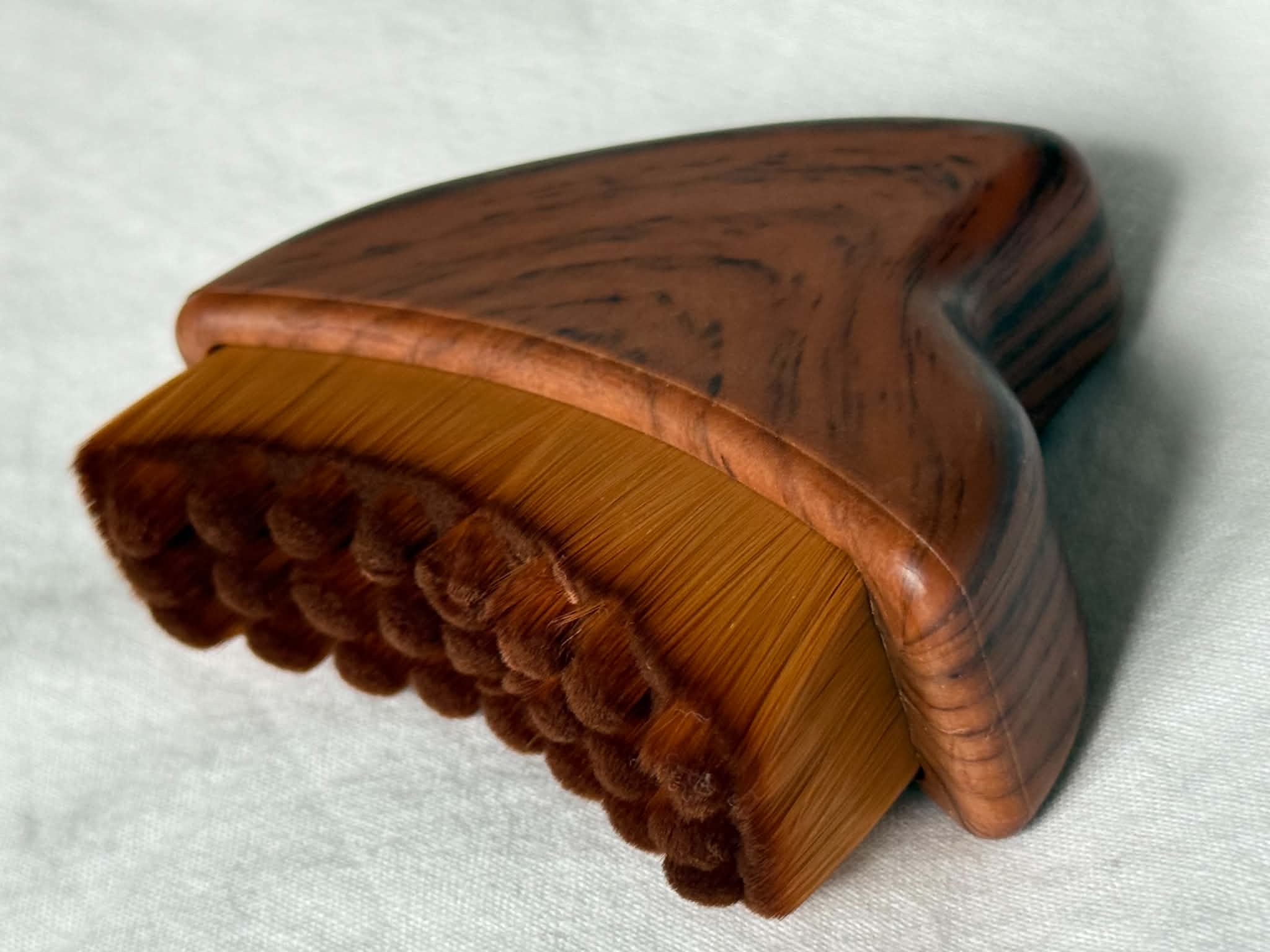 Wooden brush with bristles on a white background