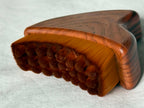 Wooden brush with bristles on a white background